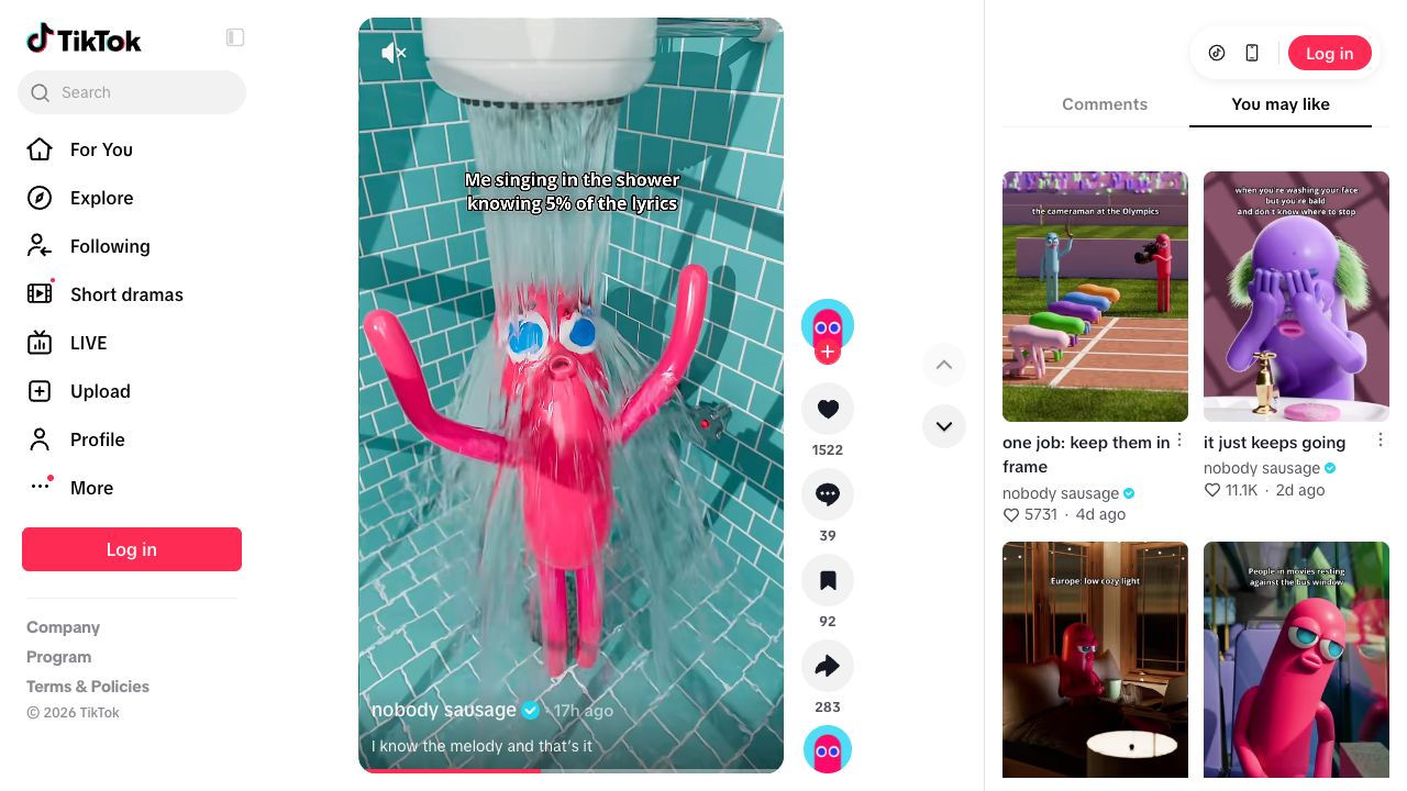 Pink Nobody Sausage character with raised arms under running water in a tiled shower